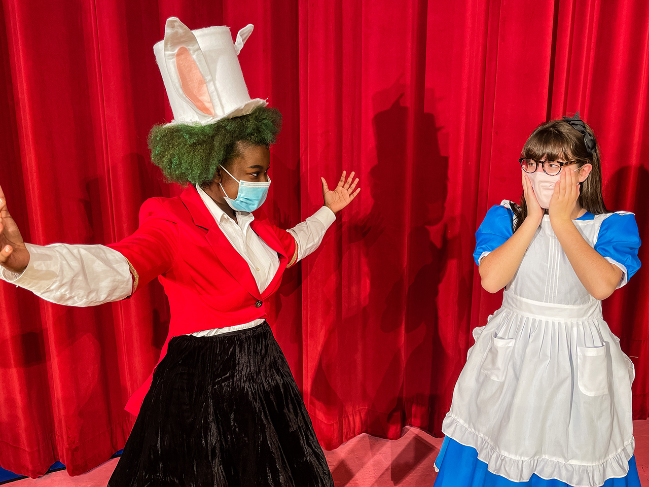 Ny'Asia Bell as the White Rabbit and Casey Moore as Alice